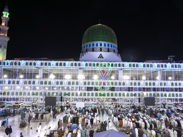 Worshippers offer prayers at the illuminated Faizan-e-Madina Masjid, adorned with vibrant lights in preparation for Eid Milad-un-Nabi, marking the 12th of Rabi-ul-Awwal. Photo: APP