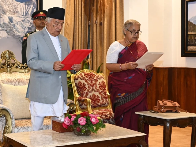 nepal s president ramchandra paudel administers the oath of office to sushila karki a former chief justice as nepal s interim prime minister during a swearing in ceremony following violent anti graft protests at the president s office in kathmandu nepal september 12 2025 photo reuters