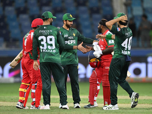 Pakistan's captain Salman Agha (C) shakes hands with Oman's players after winning the Asia Cup 2025 Twenty20 international cricket match between Oman and Pakistan at the Dubai International Stadium in Dubai on September 12, 2025. Photo: AFP