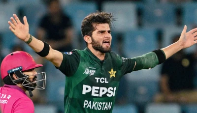 pakistan s shaheen shah afridi r gestures as uae s alishan sharafu looks on during the asia cup 2025 twenty20 international cricket match between united arab emirates and pakistan at the dubai international stadium in dubai on september 17 2025 photo afp
