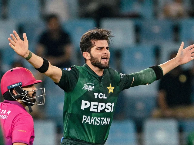 pakistan s shaheen shah afridi r gestures as uae s alishan sharafu looks on during the asia cup 2025 twenty20 international cricket match between united arab emirates and pakistan at the dubai international stadium in dubai on september 17 2025 photo afp