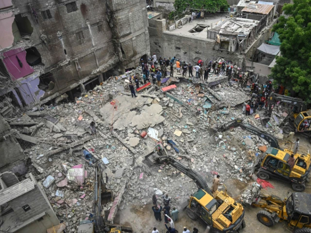 a rescue operation is underway at the site where a residential building collapsed in karachi on july 4 2025 photo afp