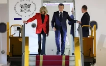 watch french president emmanuel macron s wife apparently slaps him