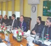 flanked by sindh chief minister murad ali shah and k p chief minister sohail afridi and others finance minister muhammad aurangzeb speaks during a meeting of the national finance commission photo express