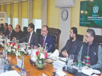 flanked by sindh chief minister murad ali shah and k p chief minister sohail afridi and others finance minister muhammad aurangzeb speaks during a meeting of the national finance commission photo express