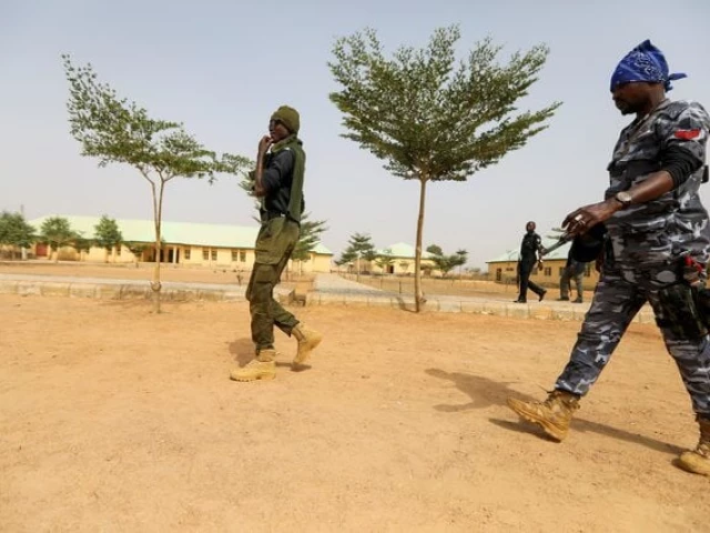 police officers walk at the jss jangebe school a day after over 300 school girls were abducted by bandits in zamfara nigeria february 27 2021 photo reuters police officers walk at the jss jangebe school a day after over 300 school girls were abducted by bandits in zamfara nigeria february 27 2021 photo reuters