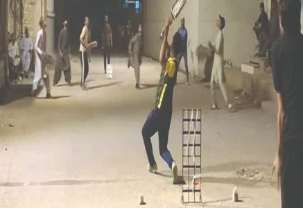 youngsters play cricket on a ramazan night using stolen electricity oblivious of ethical or religious implications photo express