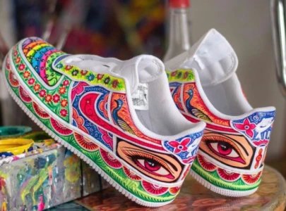 pakistani artist lauded for adorning nike sneakers with intricate truck art