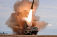 a rocket launcher fires a munition during tests involving an upgraded version of a 240 mm 24 tube multiple rocket launcher system tactical ballistic missiles and a 155 mm self propelled howitzer overseen by north korean leader kim jong un in north korea june 25 2026 photo reuters