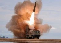 a rocket launcher fires a munition during tests involving an upgraded version of a 240 mm 24 tube multiple rocket launcher system tactical ballistic missiles and a 155 mm self propelled howitzer overseen by north korean leader kim jong un in north korea june 25 2026 photo reuters