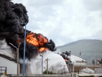 a blaze after israel s fire and rescue service said that an industrial building and fuel tanker at israel s oil refineries were hit by debris from an intercepted iranian missile in haifa israel march 30 photo reuters