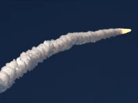 a view of the artemis ii rocket as it blasts off into space leaving behind a trail of white smoke photo anadolu agency