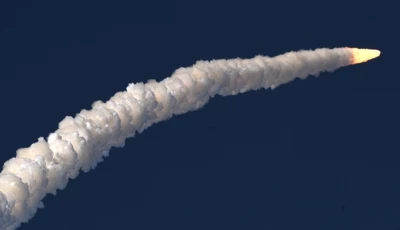 a view of the artemis ii rocket as it blasts off into space leaving behind a trail of white smoke photo anadolu agency