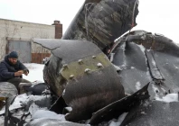 a man photographs parts of an unidentified missile which ukrainian authorities believe to be made in north korea and was used in a strike in kharkiv amid russia s attack on ukraine in kharkiv ukraine january 6 2024 photo reuters