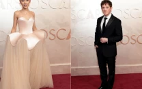 ariana grande and ethan slater arrive separately at oscars 2025 continuing red carpet trend ariana grande and ethan slater arrive separately at oscars 2025 continuing red carpet trend
