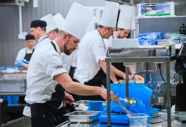 Cooks and kitchen workers prepare the 2017 Nobel Banquet in the kitchen of the Stockholm city hall. PHOTO: AFP