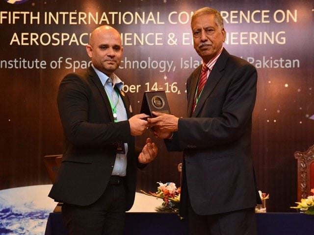 Dr Nozair Khawaja (L) receiving an award in Islamabad. PHOTO: EXPRESS