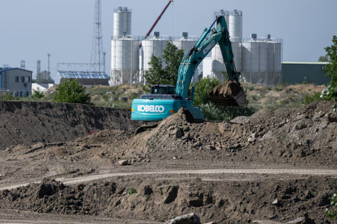 an excavator works near hungary s paks nuclear power plant to prepare the new paks ii construction site in paks hungary may 9 2023 photo reuters