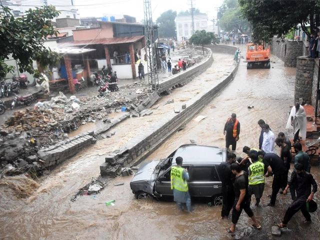 rescue workers and locals busy in drowned car lifting up in a nullah at saidpur village on july 21 photo online rescue workers and locals busy in drowned car lifting up in a nullah at saidpur village on july 21 photo online