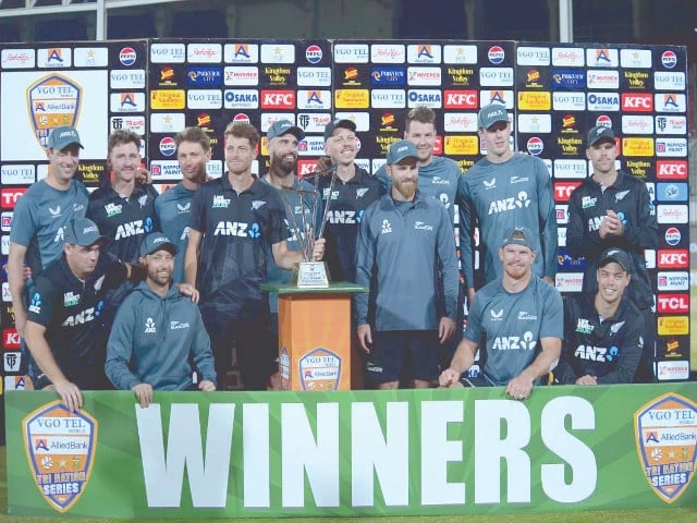 new zealand cricket team players pose with the trophy at the national bank stadium in karachi new zealand cricket team players pose with the trophy at the national bank stadium in karachi