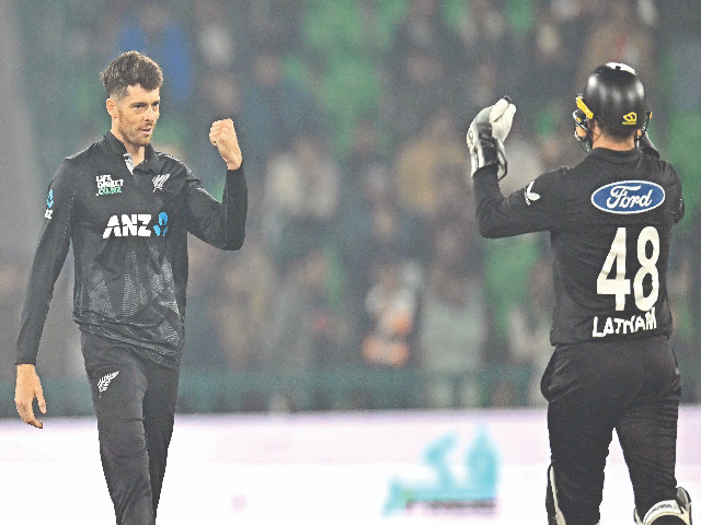 new zealand s captain mitchell santner l celebrates the wicket of pakistan s khushdil shah not pictured with new zealand s wicketkeeper tom latham during the tri nation series first odi at gaddafi stadium in lahore photo afp