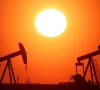 the sun sets behind oil pumps outside vaudoy en brie near paris france march 18 2026 reuters
