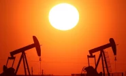 the sun sets behind oil pumps outside vaudoy en brie near paris france march 18 2026 reuters