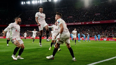 gomez inspires sevilla to victory