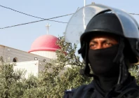 a member of security personnel stands outside saint george s greek orthodox church where gunmen opened fire during a funeral the previous day in the village of hamoud karak jordan october 24 2026 reuters