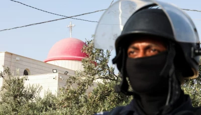 a member of security personnel stands outside saint george s greek orthodox church where gunmen opened fire during a funeral the previous day in the village of hamoud karak jordan october 24 2026 reuters