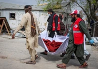 red crescent volunteers carry the body of a victim who died in what the taliban said was a pakistani air strike on a drug rehabilitation hospital in kabul afghanistan photo reuters
