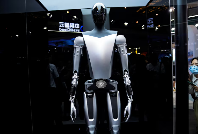 a tesla bot is displayed at the world artificial intelligence conference waic in shanghai china july 6 2023 photo reuters