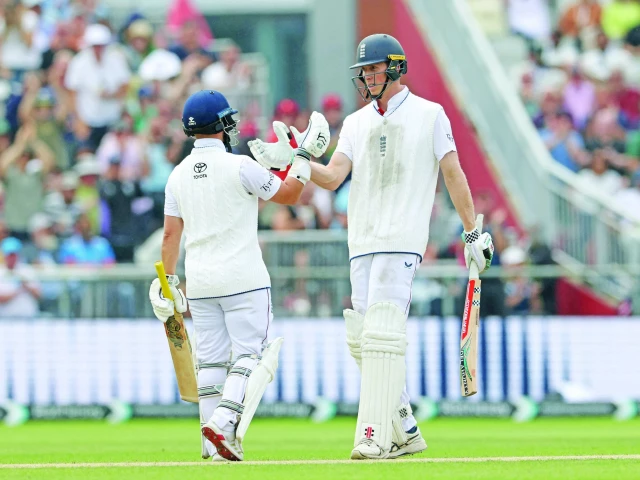 england s zak crawley r celebrates his half century with england s ben duckett on day two of the fourth test against india at old trafford photo afp