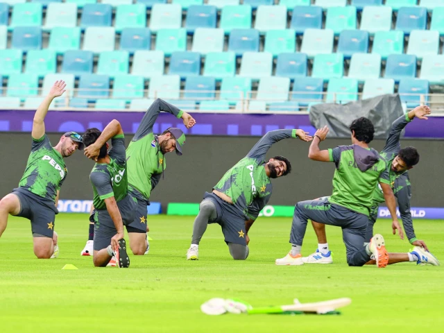 pakistan s players stretch during a practice session at the dubai international stadium on eve of their champions trophy match against india photo afp pakistan s players stretch during a practice session at the dubai international stadium on eve of their champions trophy match against india photo afp
