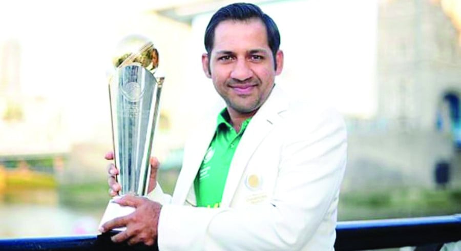 ex captain sarfaraz ahmed poses with 2017 icc champions trophy which pakistan won in england the former skipper has been named by icc among the four ambassadors for ct 2025 commencing from feb 19 photo afp