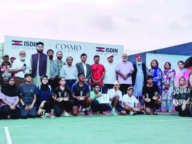 the winners and runner up players of the inaugural isdin tennis championship are seen with chief guest shahrukh khursheed sta svp khalid rehmani director sports comm karachi ghulam mohammad khan and other officials and guests at the da creek club after the finals photo kta
