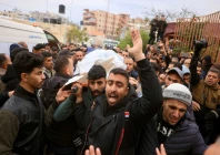 palestinian family members and colleagues carry the body of palestinian journalists killed in an israeli strike as they leave the nasser hospital for burial in khan yunis photo afp
