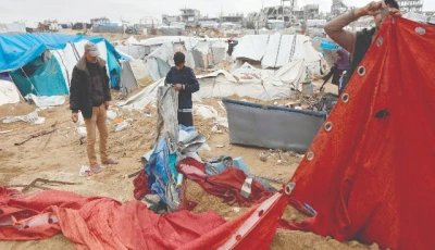 palestinian men re erect a tent shelter the day after the israeli military shelled a tented camp housing displaced families in the gaza city photo afp palestinian men re erect a tent shelter the day after the israeli military shelled a tented camp housing displaced families in the gaza city photo afp