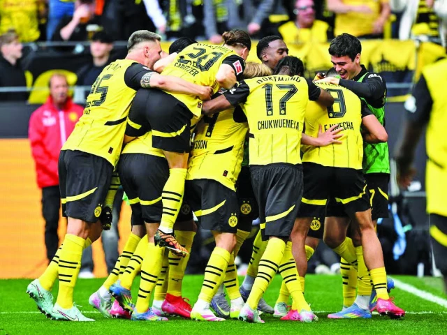 borussia dortmund s felix nmecha celebrates scoring their third goal with teammates in bundesliga match with holstein kiel photo reuters borussia dortmund s felix nmecha celebrates scoring their third goal with teammates in bundesliga match with holstein kiel photo reuters