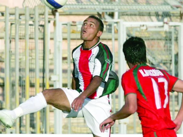 palestinian player suleiman al obeid l during a west asian football federation championship waff match in the jordanian capital amman on june 20 2007 photo afp file palestinian player suleiman al obeid l during a west asian football federation championship waff match in the jordanian capital amman on june 20 2007 photo afp file