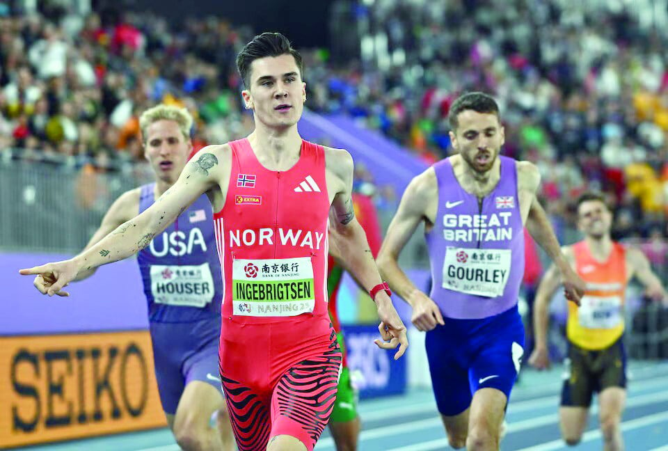 norway s jakob ingebrigtsen celebrates after winning the men s 1500m final during the world athletics indoor championships at nanjing youth olympic sports park on march 23 photo reuters