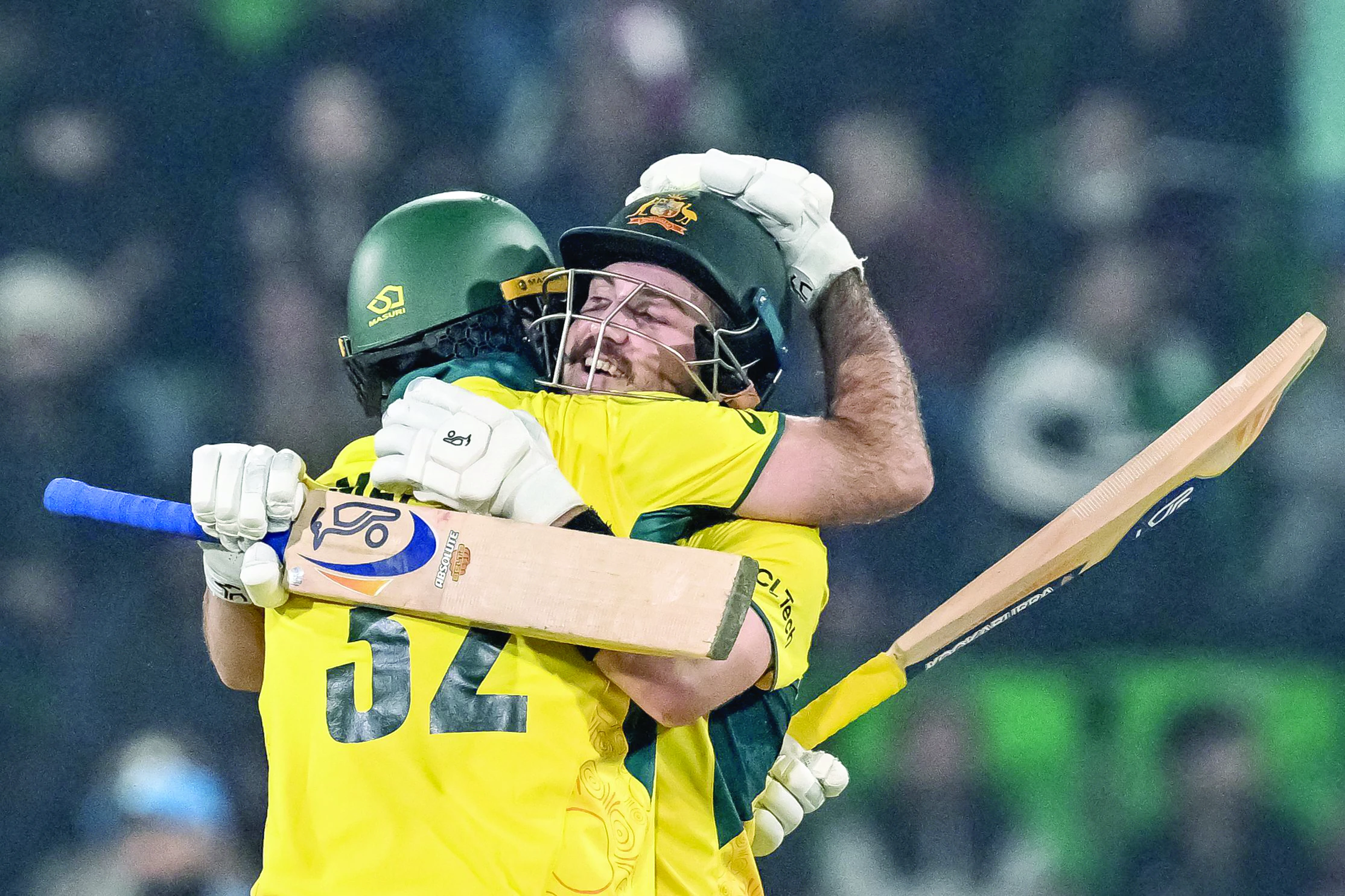 australia s josh inglis r celebrates with teammate maxwell after scoring a century during the icc champions trophy one day international odi against england at the gaddafi stadium in lahore on february 22 photo afp australia s josh inglis r celebrates with teammate maxwell after scoring a century during the icc champions trophy one day international odi against england at the gaddafi stadium in lahore on february 22 photo afp