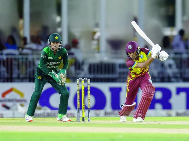 west indies batsman jewel andrew r bats as pakistani wicket keeper mohammad nawaz looks on during the first twenty20 t20 international cricket match at central broward park broward county stadium in lauderhill florida on july 31 photo afp