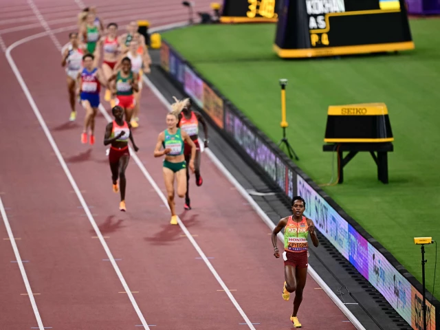 faith kipyegon competes the finish line to win the women s 1500m final during the world athletics championships in tokyo photo afp