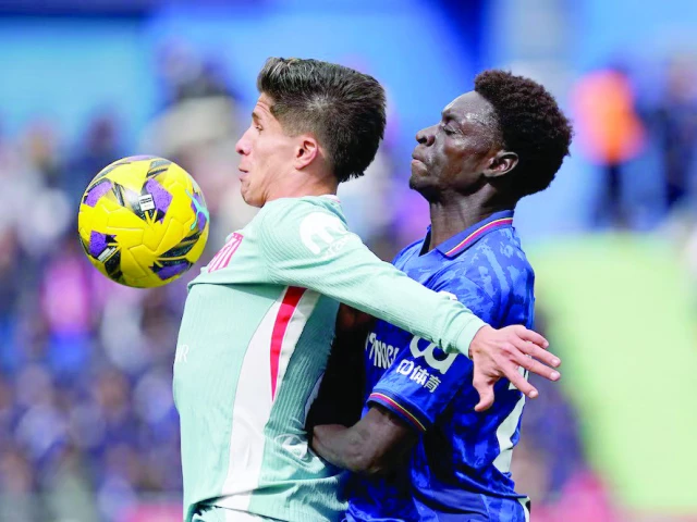 atletico madrid s giuliano simeone in action with getafe s coba da costa during the laliga fixture at estadio coliseum getafe on march 9 photo reuters atletico madrid s giuliano simeone in action with getafe s coba da costa during the laliga fixture at estadio coliseum getafe on march 9 photo reuters