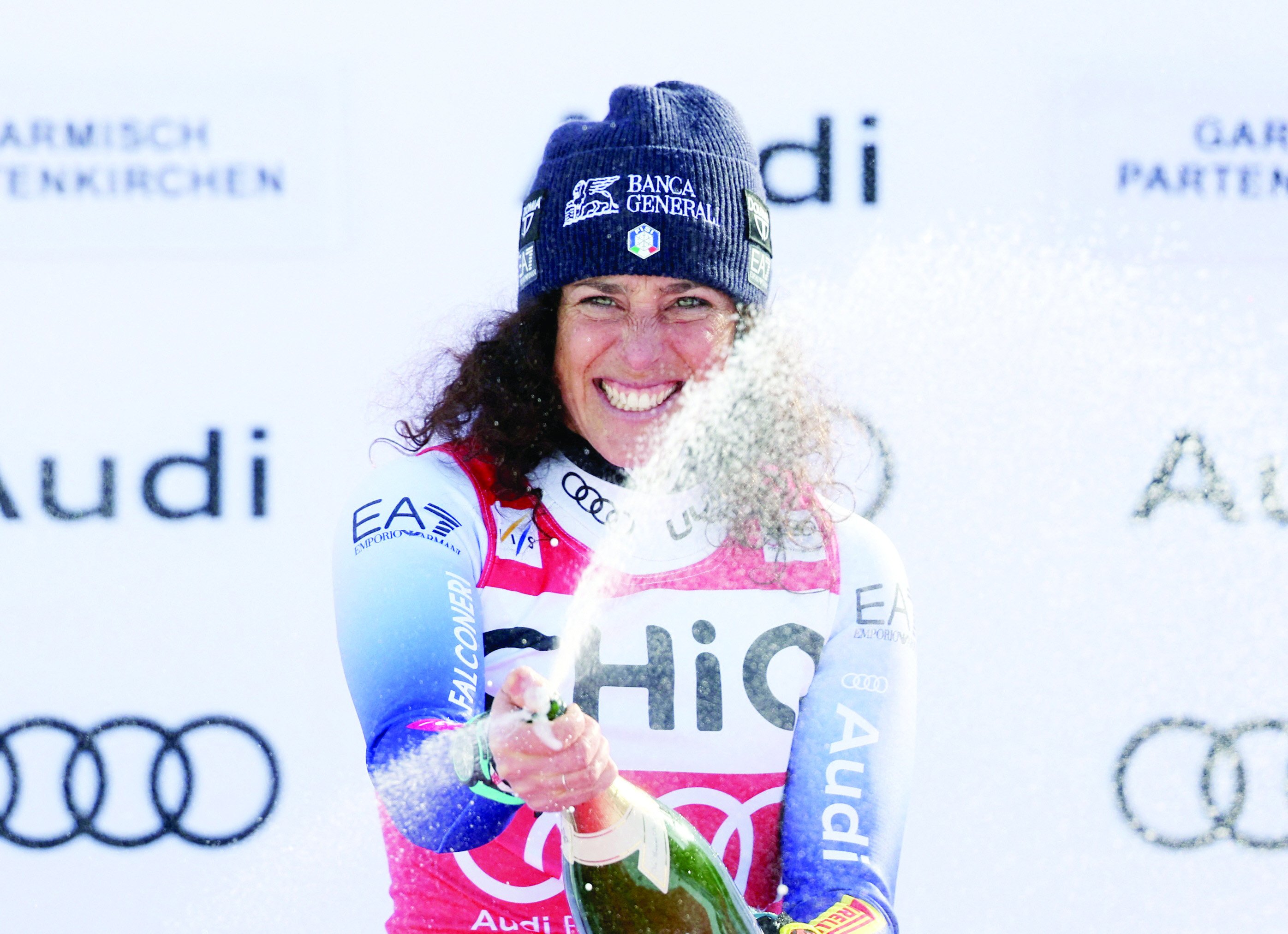 italy s federica brignone celebrates on the podium after winning the women s fis alpine ski world cup downhill at garmisch partenkirchen on january 25 photo reuters