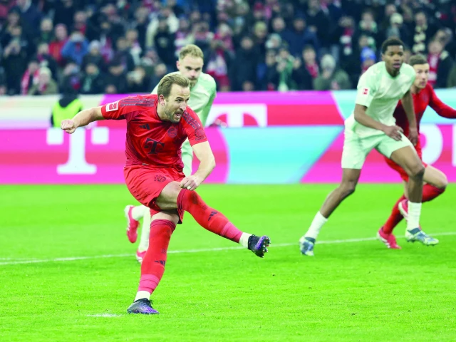 bayern munich s harry kane takes a free kick and scores the third goal during the german first division bundesliga match with sv werder bremen in munich southern germany on february 7 photo afp bayern munich s harry kane takes a free kick and scores the third goal during the german first division bundesliga match with sv werder bremen in munich southern germany on february 7 photo afp