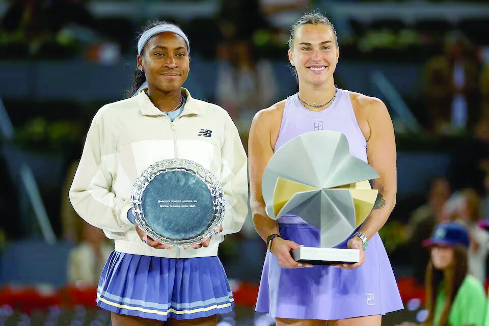 aryna sabalenka r and coco gauff l pose with the winner s and runner s up trophies after their madrid open singles final photo reuters aryna sabalenka r and coco gauff l pose with the winner s and runner s up trophies after their madrid open singles final photo reuters