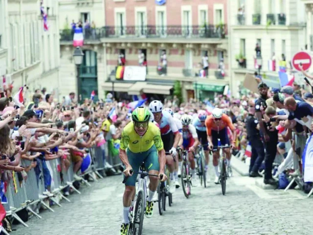 riders in the 2024 men s olympic road race navigate the cobbled roads of montmartre photo afp riders in the 2024 men s olympic road race navigate the cobbled roads of montmartre photo afp