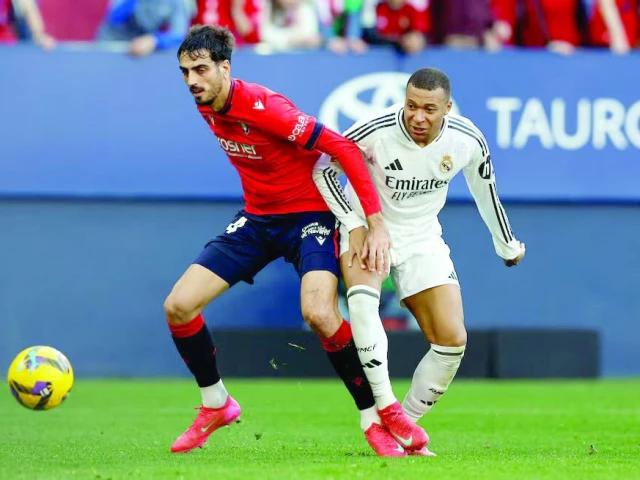 real madrid s kylian mbappe in action with osasuna s alejandro catena during the la liga match at el sadar stadium pamplona on february 15 photo reuters real madrid s kylian mbappe in action with osasuna s alejandro catena during the la liga match at el sadar stadium pamplona on february 15 photo reuters